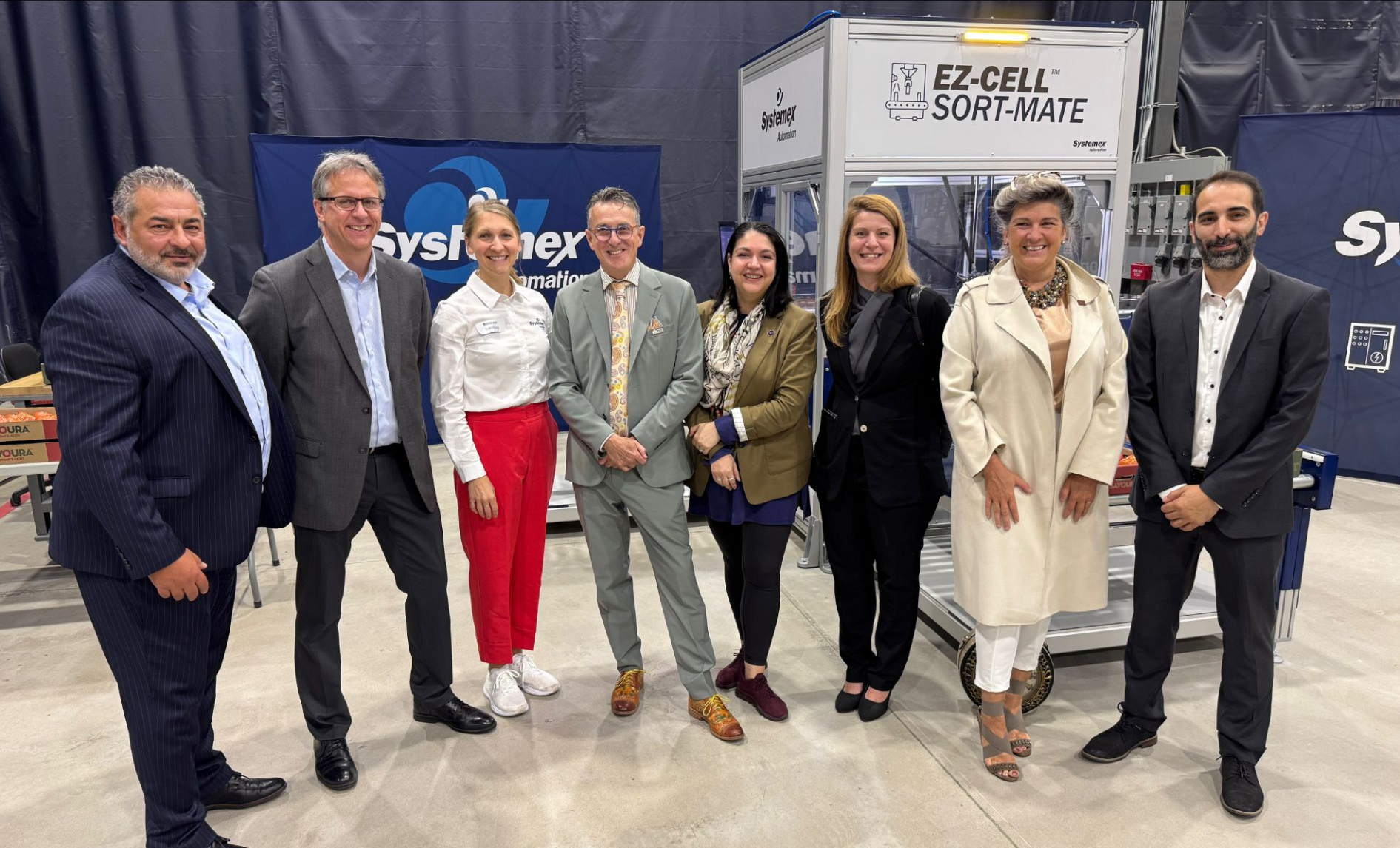 Systemex representatives and distinguished guests in front of the EZ-CELL™ Sort-Mate cell at the launch event